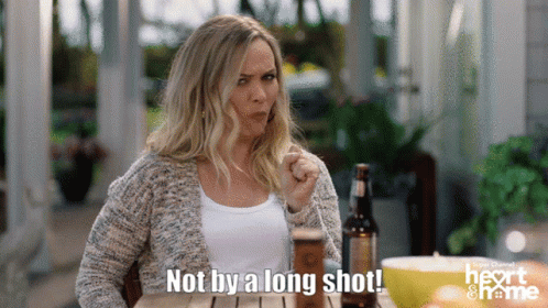Woman Sitting At Table With Beer Saying Not By A Long Shot GIF