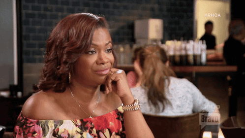 Woman Sitting at Table with Bravo
