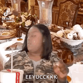 Woman Sitting at Table with Coffee