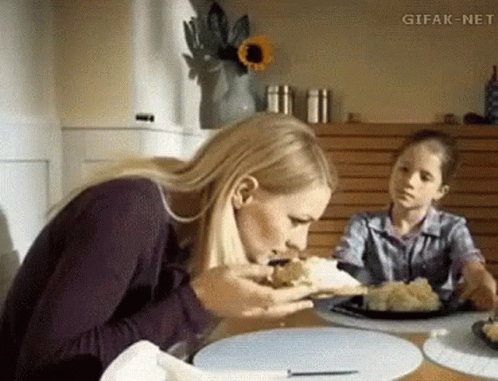Woman Sitting at Table with Food