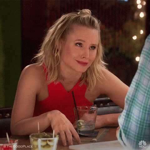 Woman Sitting At Table With Glass Of Water GIF