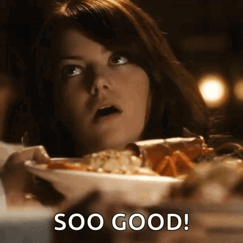Woman Sitting at Table With Soo Good Food