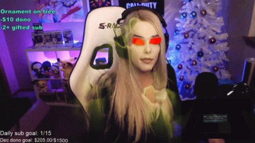Woman Sitting By White Christmas Tree With Call Of Duty Shirt GIF