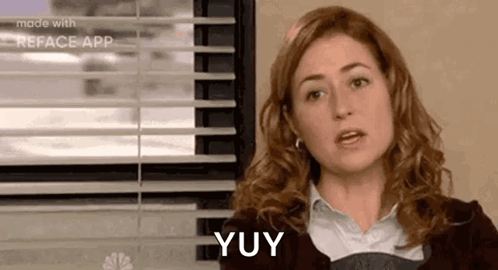 Woman Sitting by Window Saying Yuy
