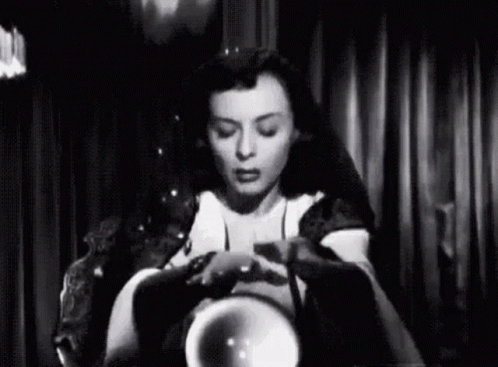 Woman Sitting Holding Crystal Ball