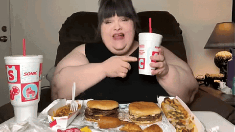 Woman Sitting Holding Sonic Cup GIF