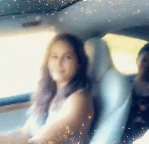Woman Sitting In Back Seat With Man Behind GIF