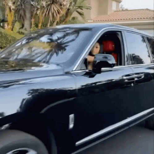Woman Sitting in Black Rolls Royce