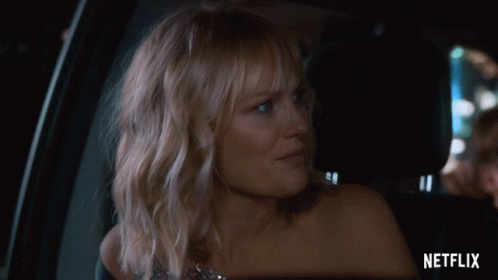 Woman Sitting in Car Back Seat with Netflix Logo