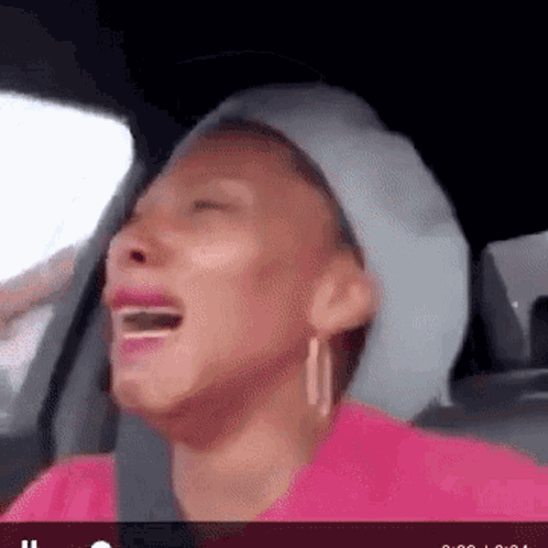 Woman Sitting in Car Crying