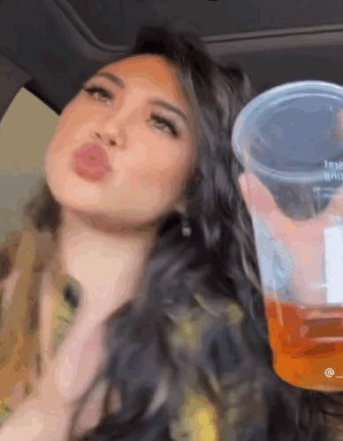 Woman Sitting In Car Holding Cup Saying Jesus GIF
