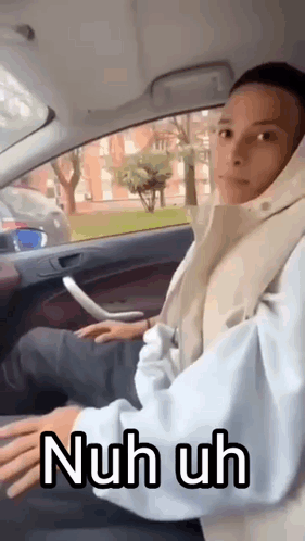 Woman Sitting in Car Hood