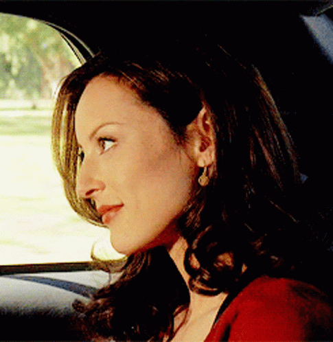 Woman Sitting in Car Looking Out Window