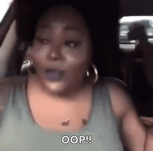 Woman Sitting in Car Saying Oops
