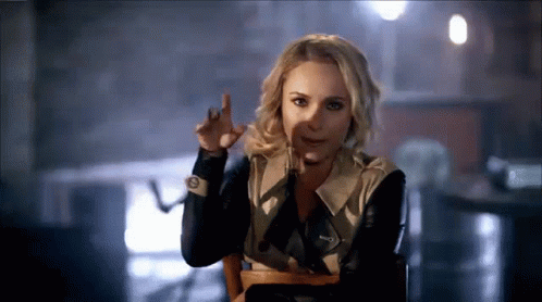 Woman Sitting In Chair Funny Face With Finger GIF