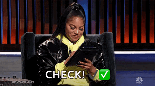 Woman Sitting in Chair Holding Tablet and Check Emoji