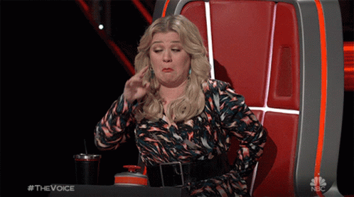 Woman Sitting in Chair Saying The Voice