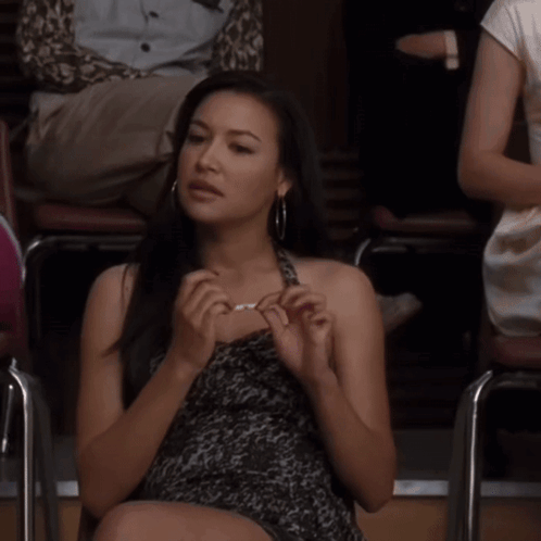 Woman Sitting In Chair With Crossed Legs GIF