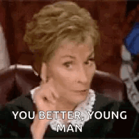 Woman Sitting In Chair With Hand On Chin GIF