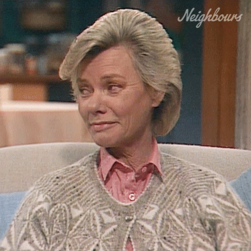 Woman Sitting In Chair With Neighbours GIF