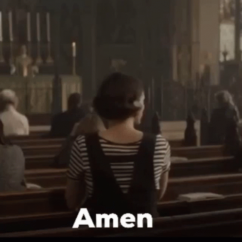 Woman Sitting in Church Saying Amen