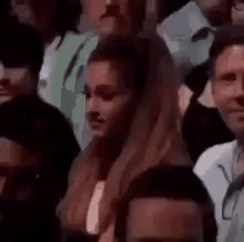 Woman Sitting in Crowd Looking