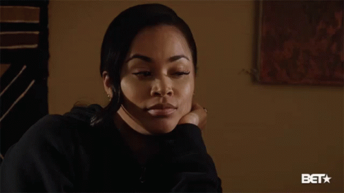 Woman Sitting In Front Of BET Logo GIF