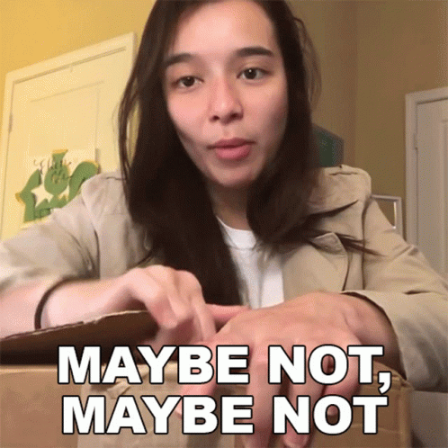 Woman Sitting in Front of Box Saying Maybe Not