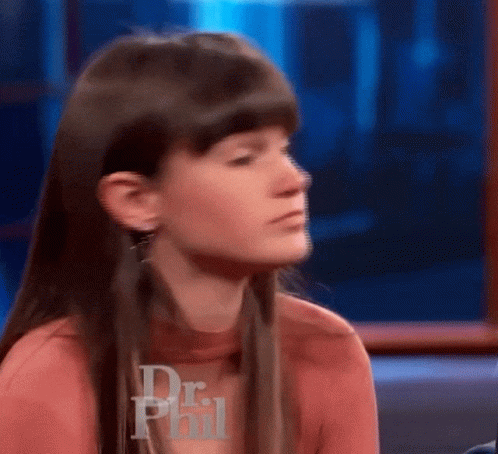 Woman Sitting In Front Of Dr Phil Logo GIF