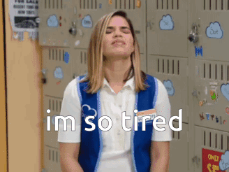 Woman Sitting in Front of Lockers Eyes Closed Im So Tired