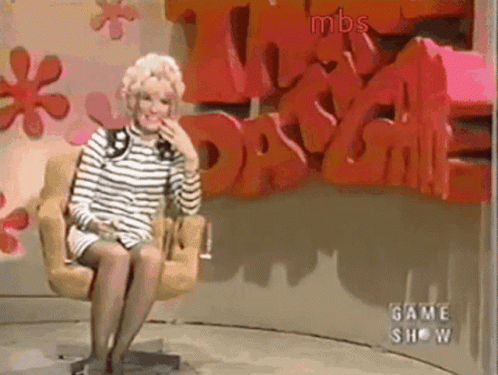 Woman Sitting in Front of MBS Wall