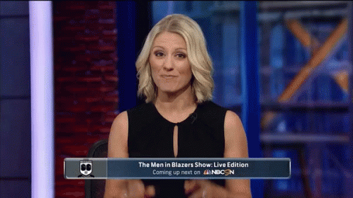Woman Sitting in Front of Men in Blazers Sign