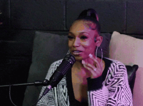 Woman Sitting in Front of Microphone