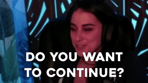 Woman Sitting in Front of Microphone With Do You Want to Continue Behind Her