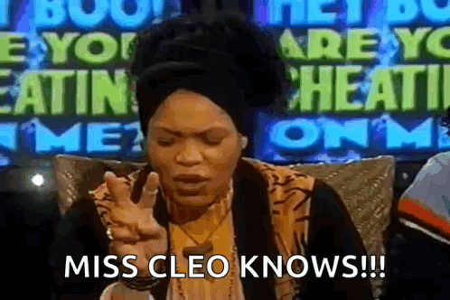 Woman Sitting in Front of Miss Cleo Knows Sign