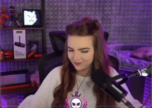 Woman Sitting In Front Of Shure Microphone In Purple Room GIF