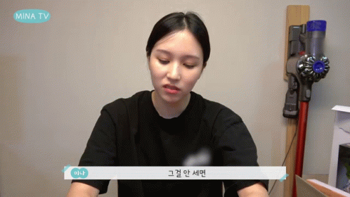 Woman Sitting In Front Of Vacuum Cleaner GIF