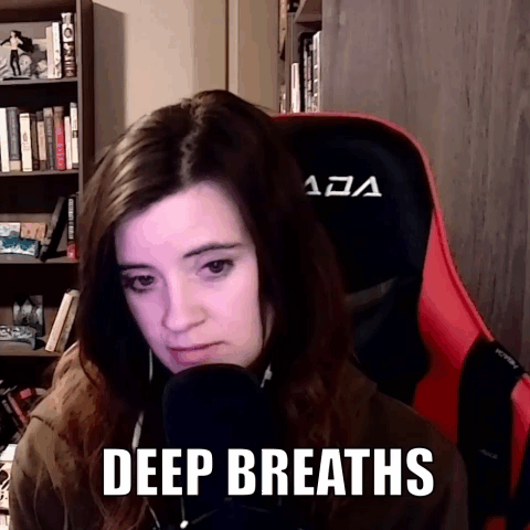 Woman Sitting in Red Chair Deep Breaths