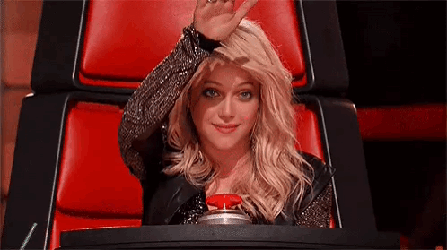 Woman Sitting in Red Chair Waving