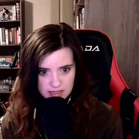 Woman Sitting In Red Chair With A GIF