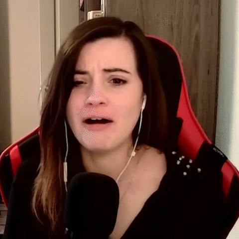 Woman Sitting In Red Chair With Microphone And Headphones GIF