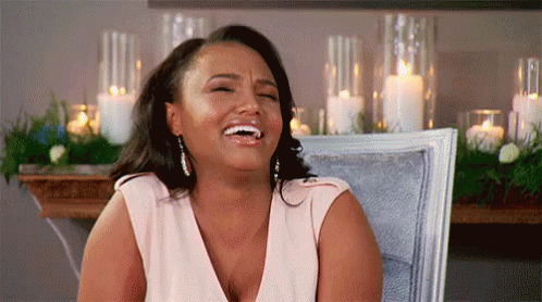 Woman Sitting Laughing