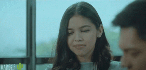 Woman Sitting Next to Man with Mainegif Logo