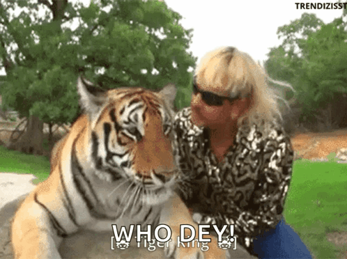 Woman Sitting Next to Tiger Saying Who Dey Tiger King
