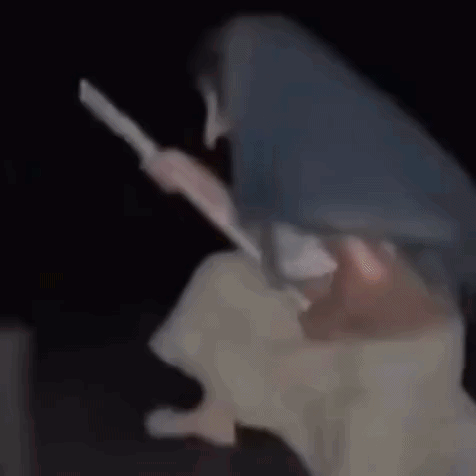Woman Sitting On Broom In Darkness GIF