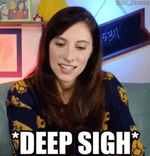 Woman Sitting On Couch Deep Sigh GIF