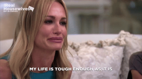 Woman Sitting On Couch Eyes Closed Saying My Life Is Tough Enough As It Is GIF
