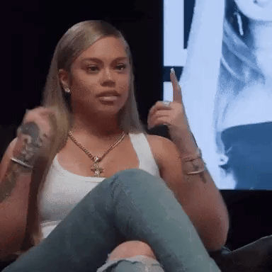 Woman Sitting On Couch Holding Microphone GIF