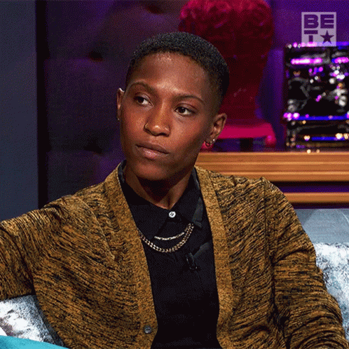 Woman Sitting On Couch In Front Of Be On It Sign GIF