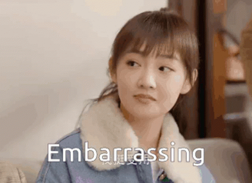 Woman Sitting on Couch Making Embarrassed Face